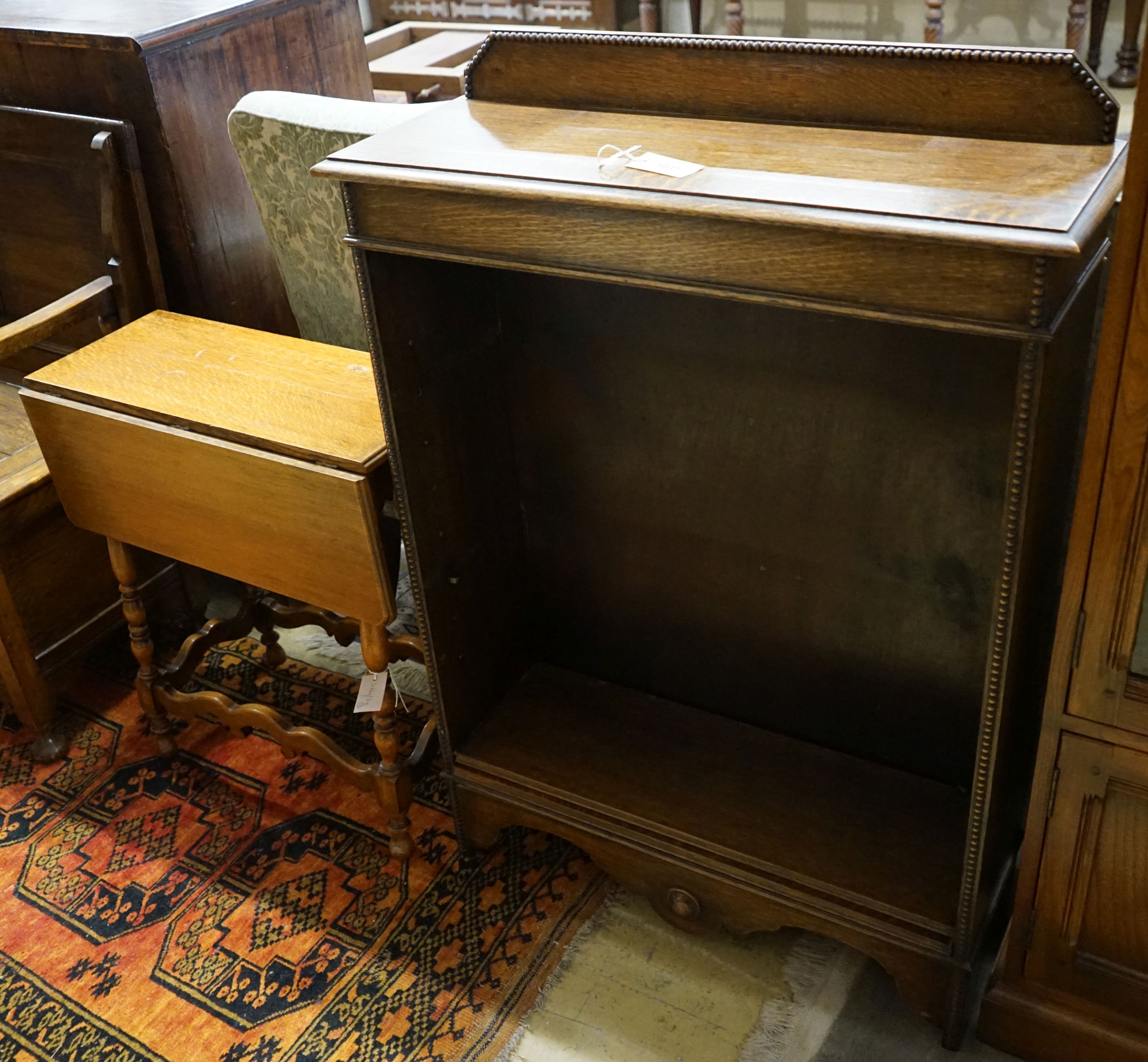 A small oak open bookcase, width 76cm, depth 27cm, height 109cm, together with a small oak gateleg occasional table